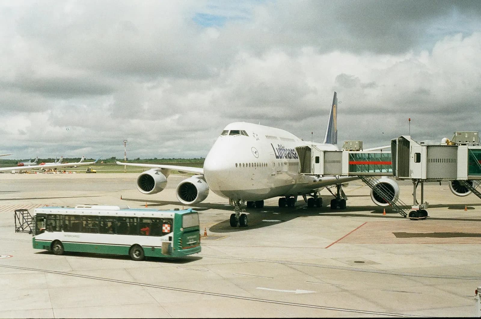 Group vehicle at a Sky Harbor Airport curb with passengers and luggage ready to load